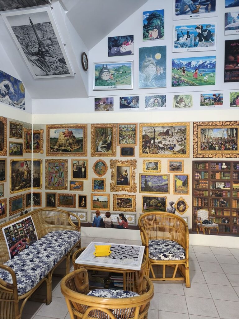 Shop with completed jigsaw puzzles on walls