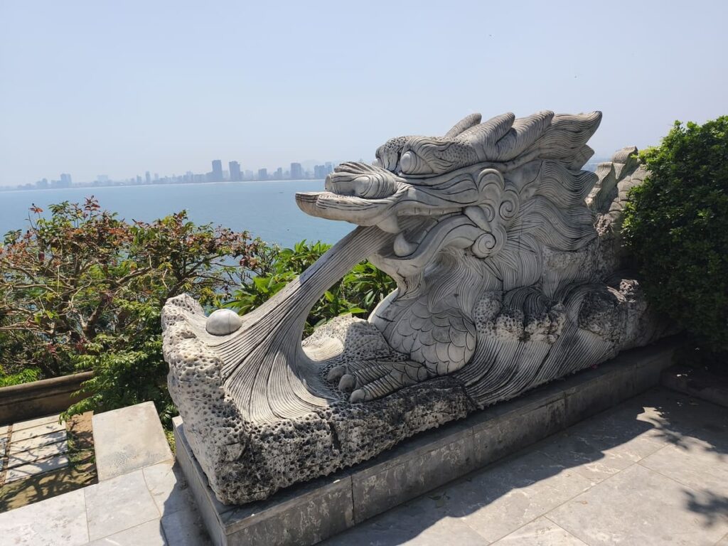 Dragon statue with Da Nang in background