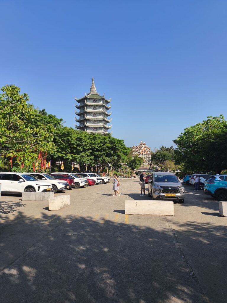 The Grab drop-off/pick up is between tower and temple