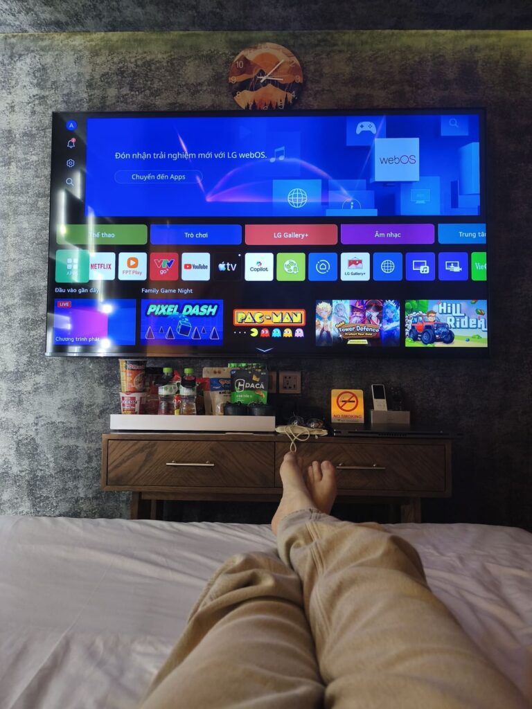 Large TV screen seen from bed