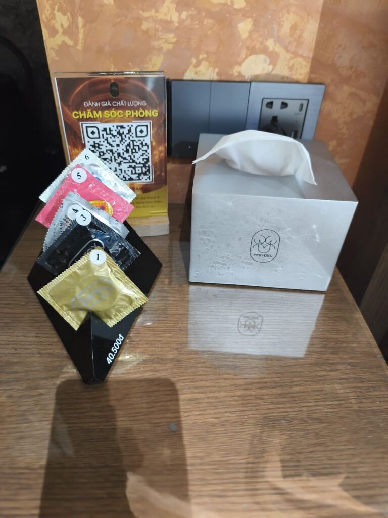 Rack with condoms on nightstand