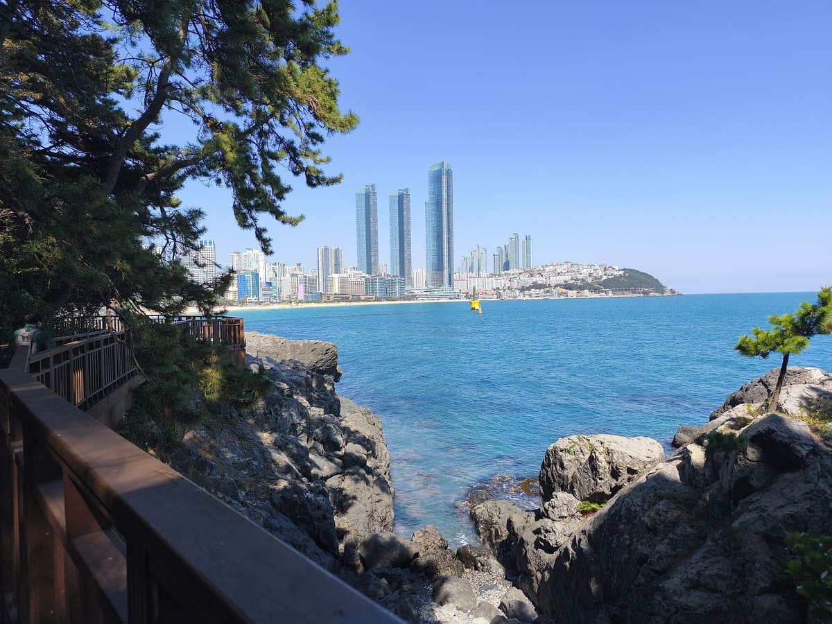 Haeunda beach with sky scrapers seen from peninsula