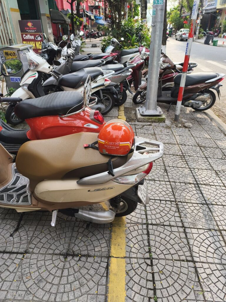 Sidwalk packed with scooters in Vietnam