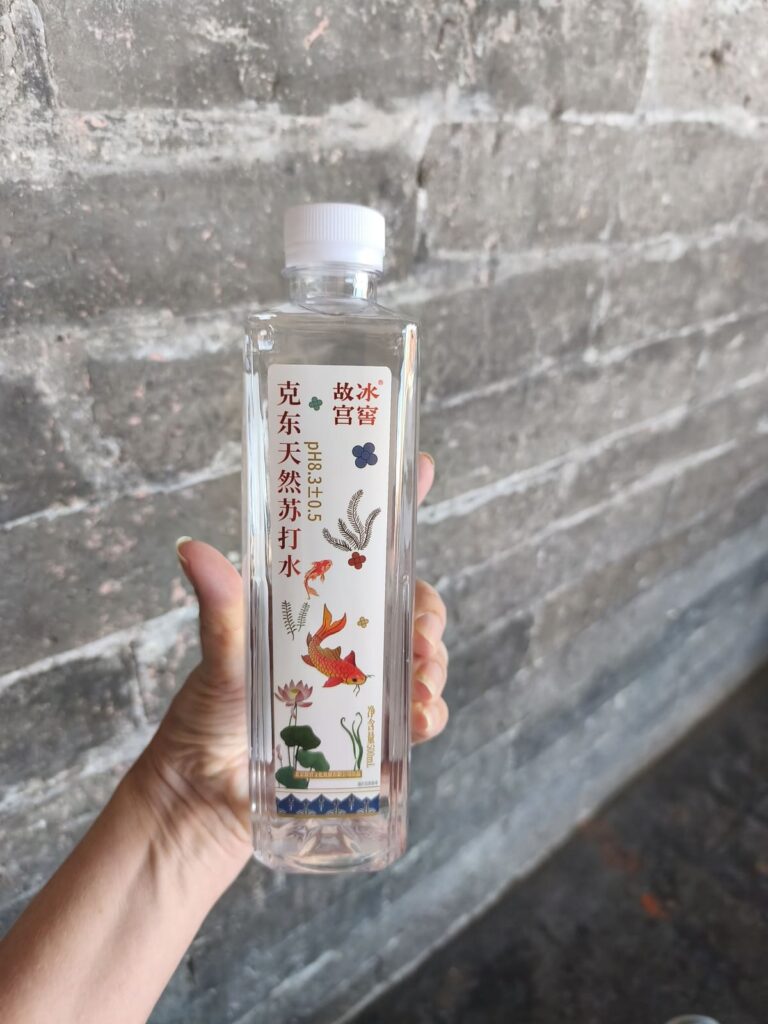 Hand holding water bottle