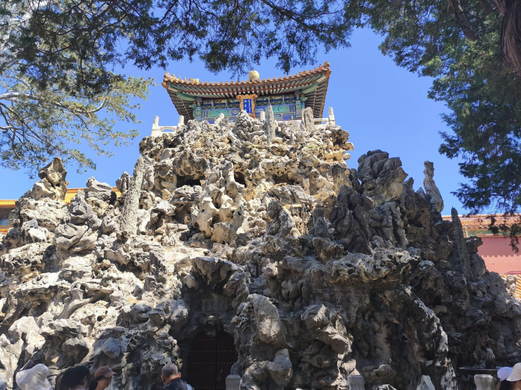 Jagged rock with small building on top