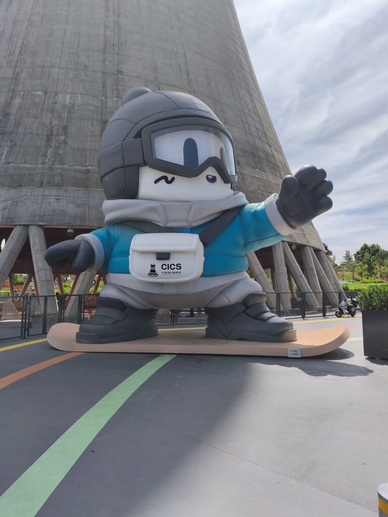 Large figure next to cooling tower
