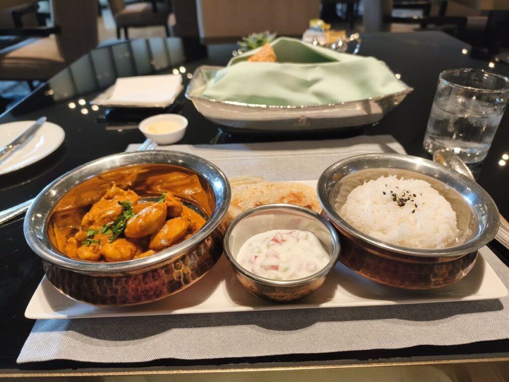 Curry dish with sides at Peninsula, Beijing