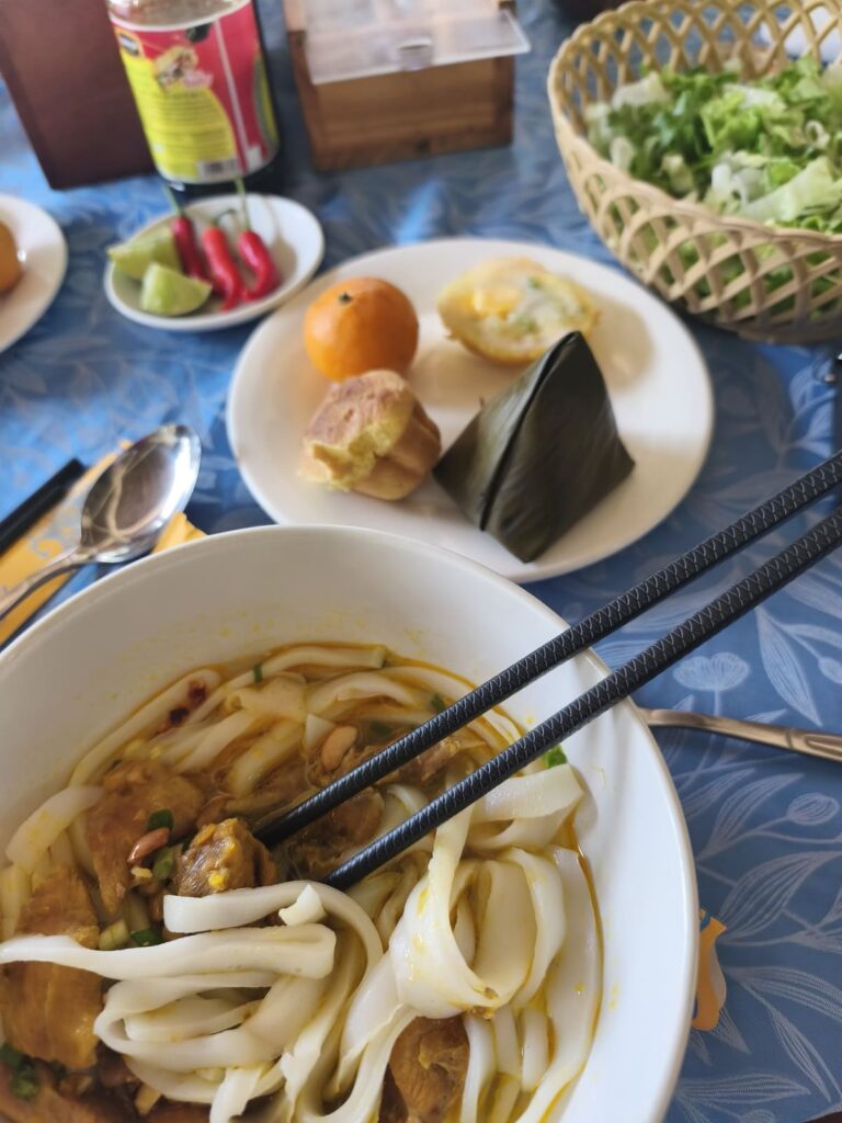 Table with lunch: Quang Noodles and small dishes
