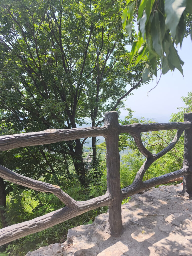 Small fenced area with view over mountains