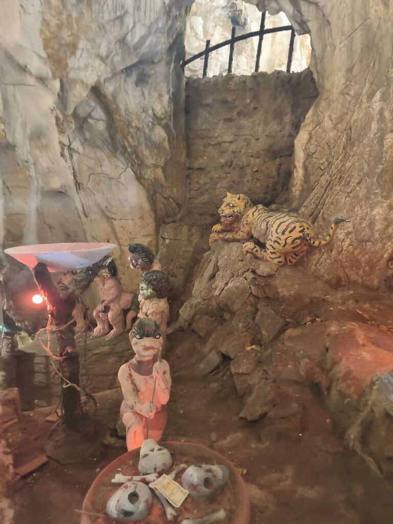 Colorful but slightly creepy statues in Am Phu Cave