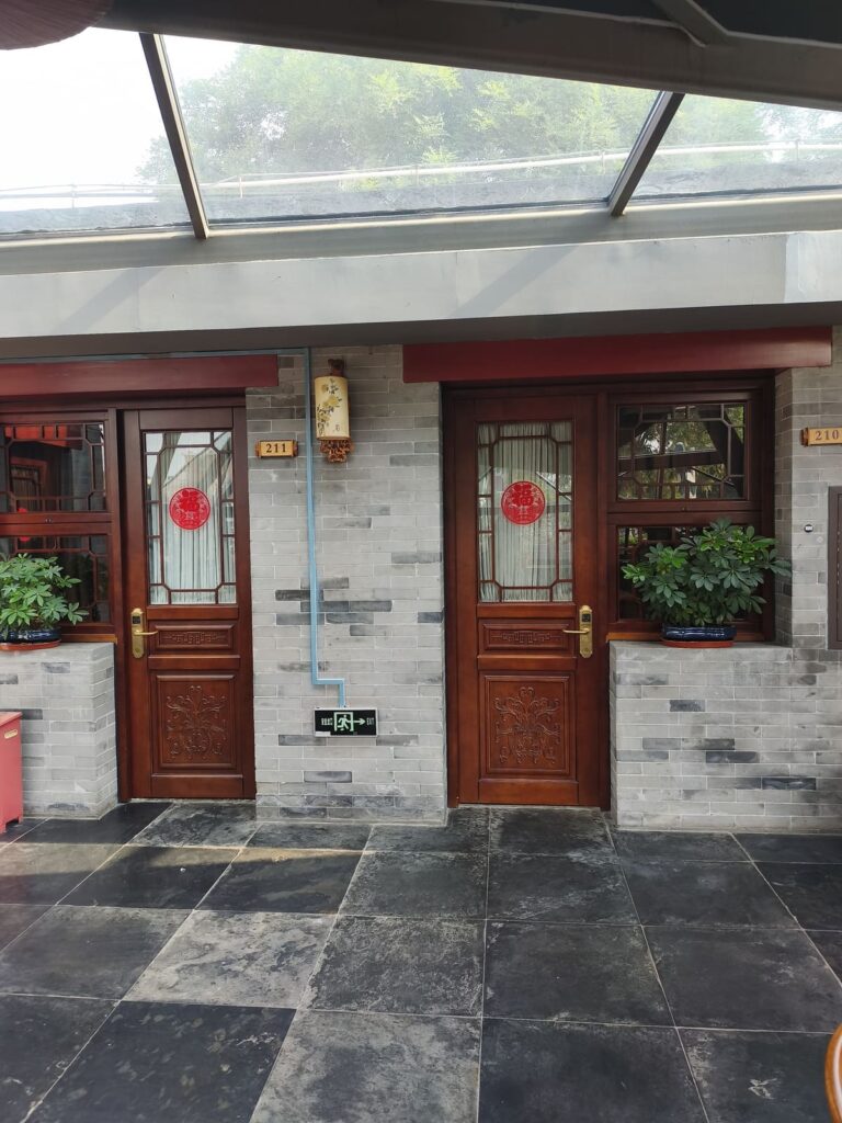 Interior courtyard with room door at Youfang Hotel