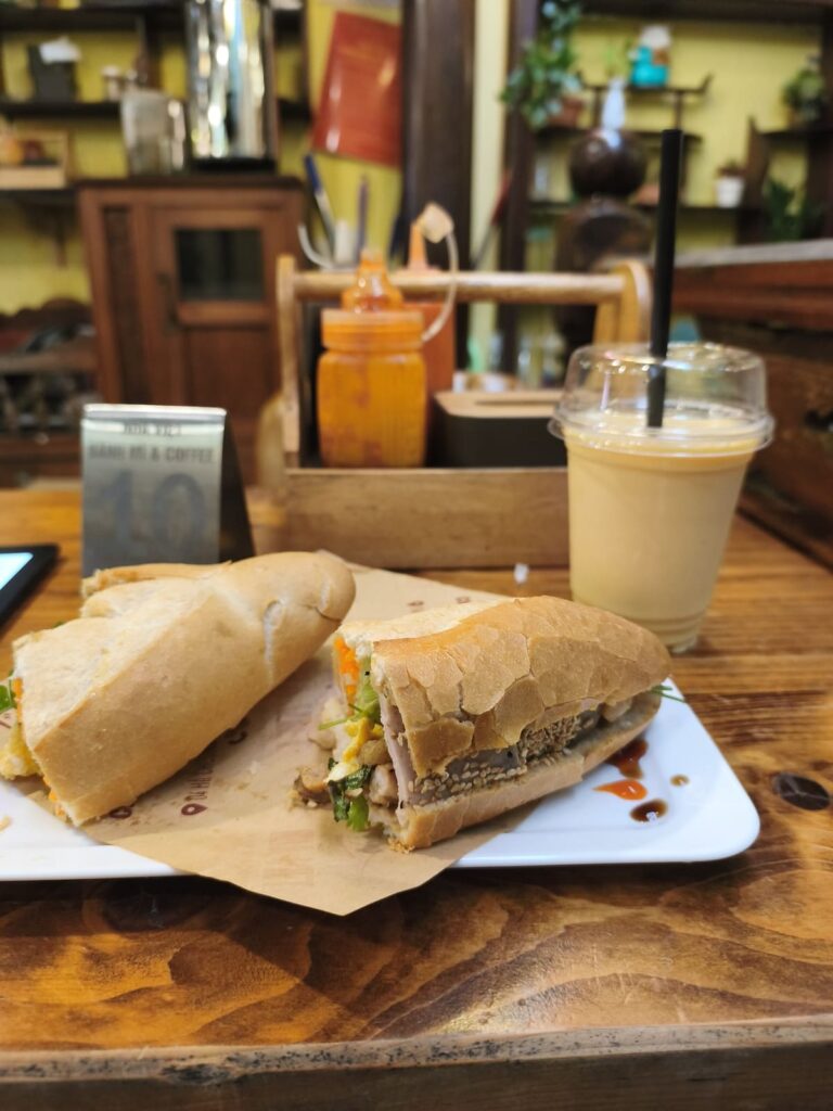 Table with Banh Mi and drink in Da Nang