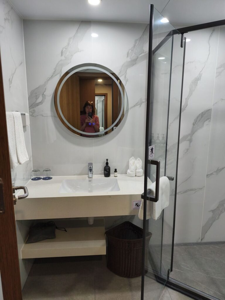 Bathroom with shower at CSN Pearl Hotel
