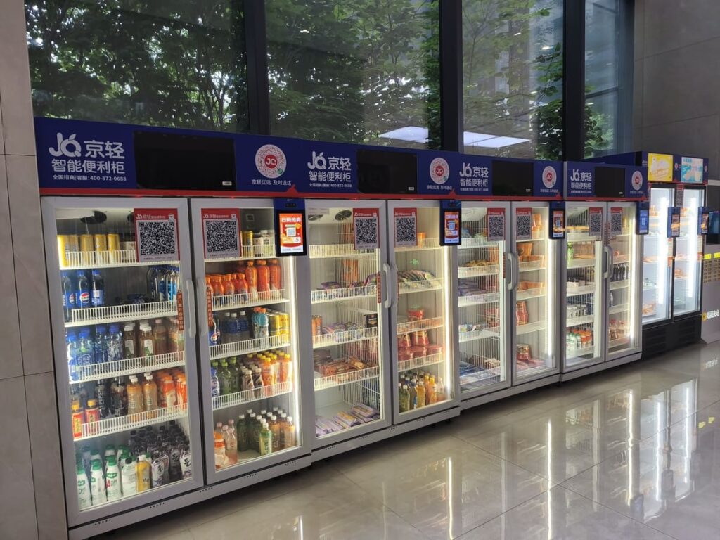 Long row of very modern vending machines.