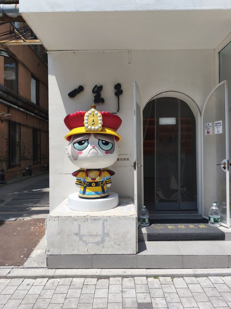 Cat statue in front of store