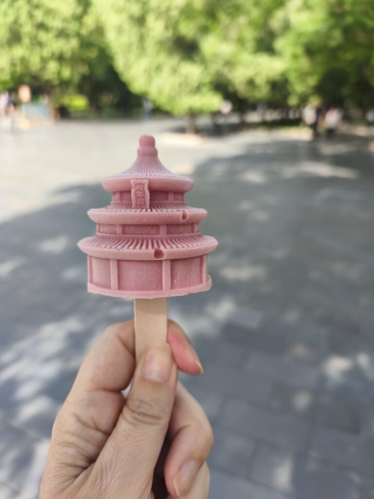 Hand holding ice cream shaped like Temple of Heaven