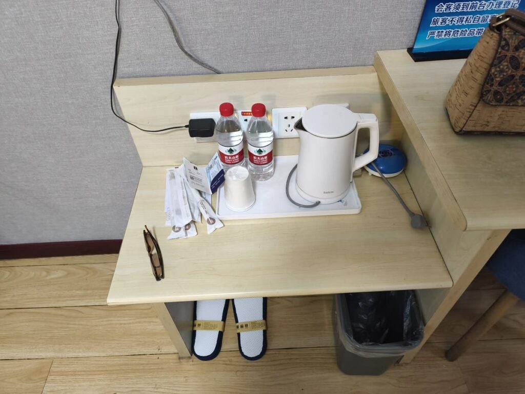 Desk with water bottles and amenities